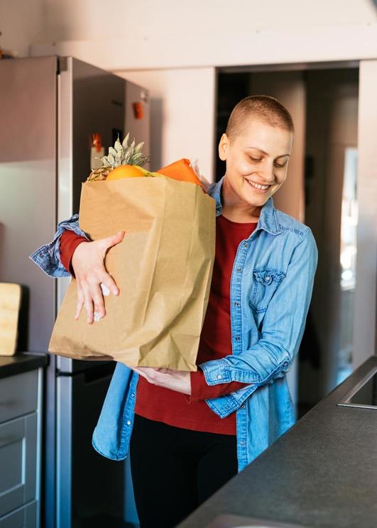 Cancer patient carrying groceries