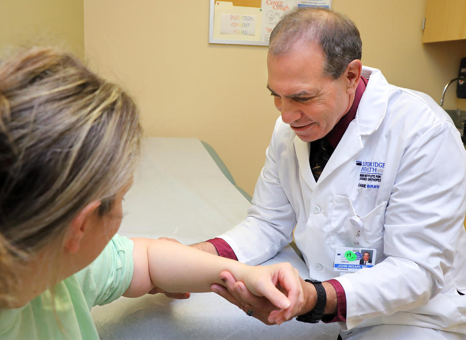 Dr. Ingari with a patient