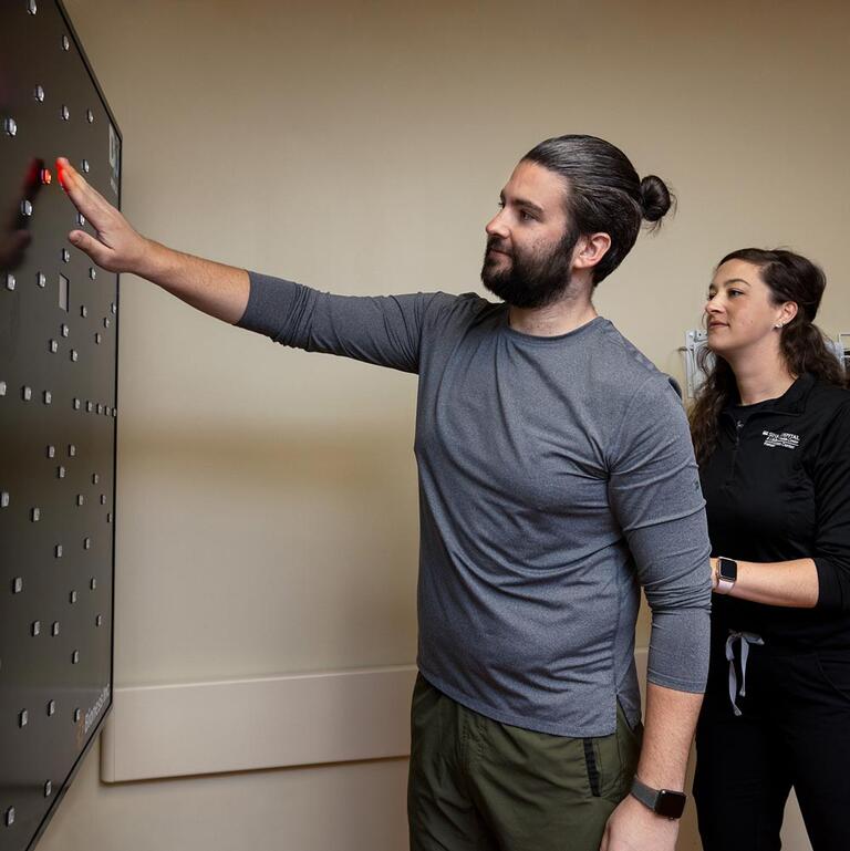Patient receiving neurological rehab therapy