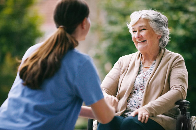 Shot of a senior woman in a wheelchair being cared for a nurse