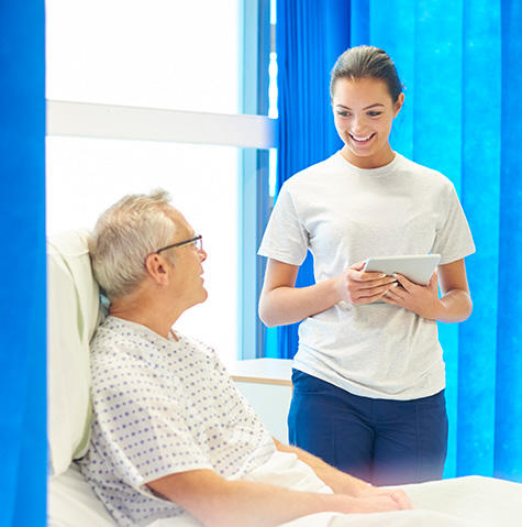 A volunteer talking to a patient A volunteer talking to a patient