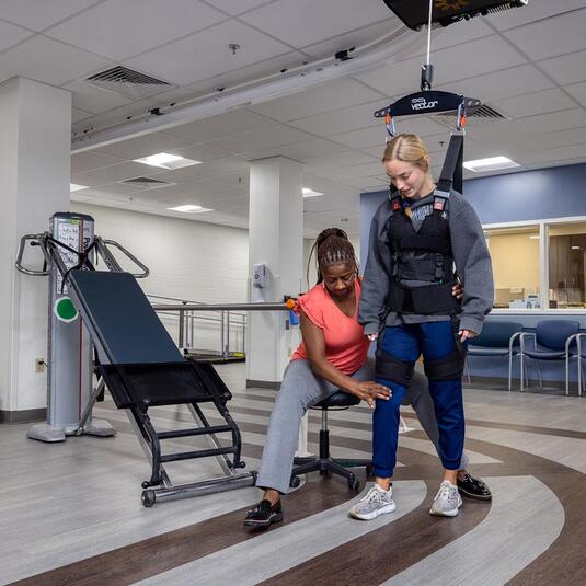 Patient getting walking therapy Patient getting walking therapy