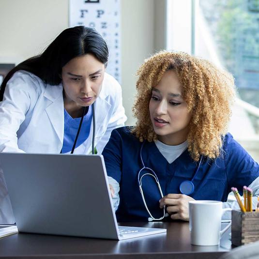 A nursing instructor and student A nursing instructor and student