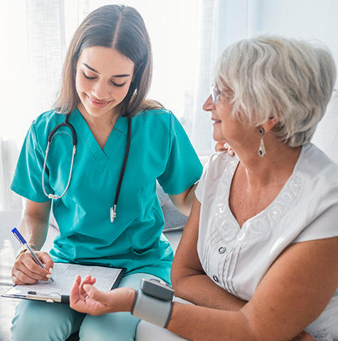 Geriatric patient visiting her primary doctor Geriatric patient visiting her primary doctor