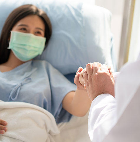 Patient with mask meeting with a doctor Patient with mask meeting with a doctor