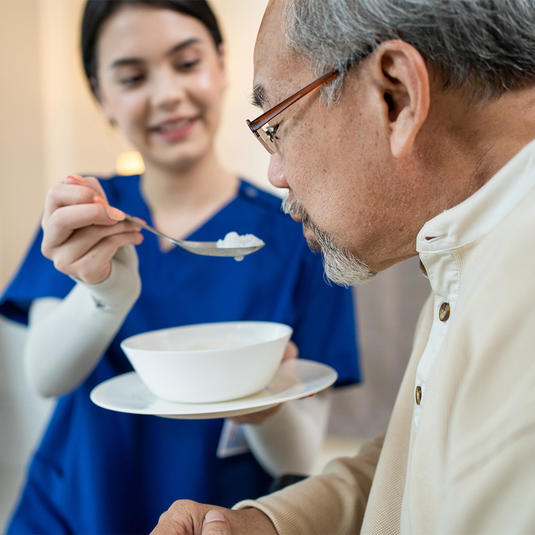 Patient going through swallowing therapy Patient going through swallowing therapy