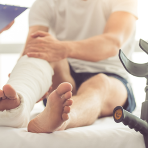 a person wearing a cast on their leg